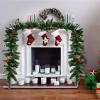 imageGoplus 9ft Snow Flocked Christmas Garland with 50 LED Lights PreLit Battery Operated Artificial Garland with White Berries ampamp Poinsettias Flowers Timer Snowy Holiday Decoration for Mantel IndoorGreen